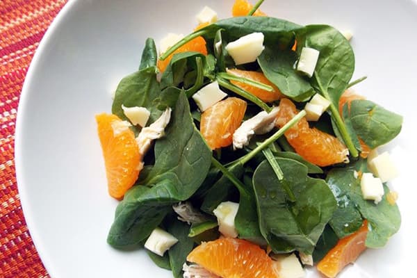 Salad with chicken, spinach and tangerines