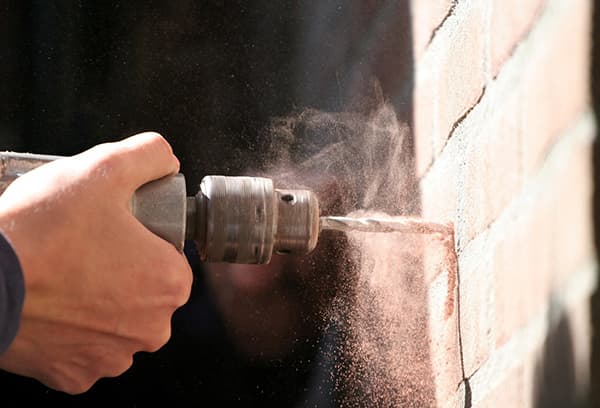 Dust when drilling bricks