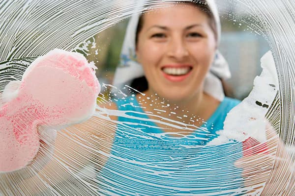 Woman washing glass