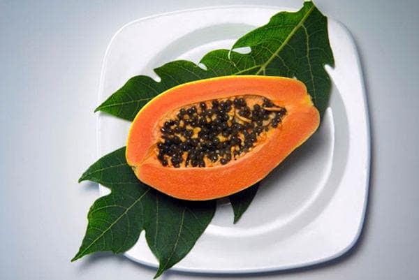 Half a papaya on a plate