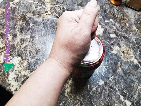 hit the lid of the can with your fist