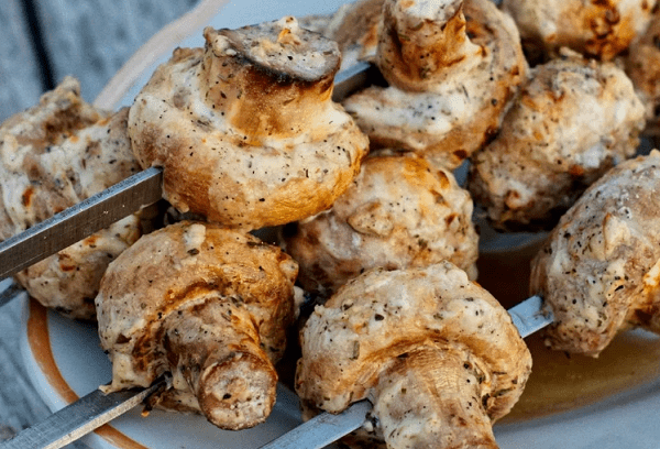 Champignon mushrooms on the grill