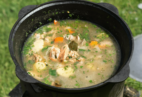 Grandfather's recipe for fish soup in a cauldron