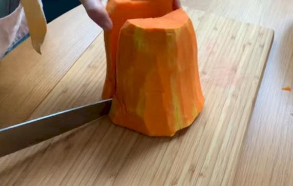 Cutting a pumpkin into halves